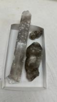 Three old crystals largest measures approximately 12 inches