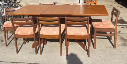 Mid century White≠wton teak extending dining table with 8 chairs when extended measures approx 28.