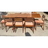 Mid century White≠wton teak extending dining table with 8 chairs when extended measures approx 28.