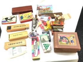 Box of toys and games includes tin automatic telephone, card games and play mobile