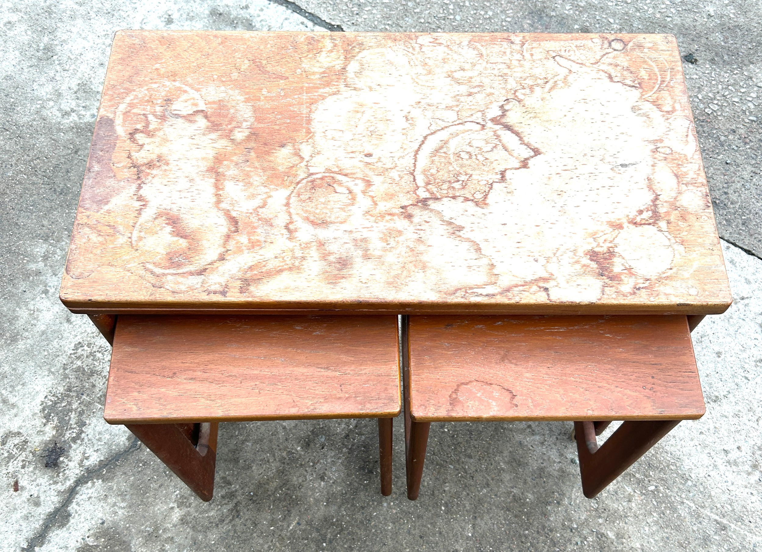 Teak nest of three tables in need of repair to top - water damaged - Image 2 of 3