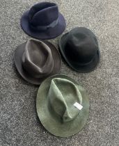 Four top hats to include the names ' Earl land Brothers', 'Wood row Piccadilly London' etc