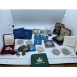 Large selection of vintage and later coins to include a half dollar silver coin, decimals etc