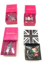 Four Boxed Butler and Wilson Christmas themed brooches, 3 have never been out of the packaging