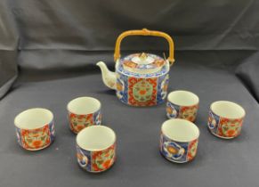 Oriental tea pot and 6 cups