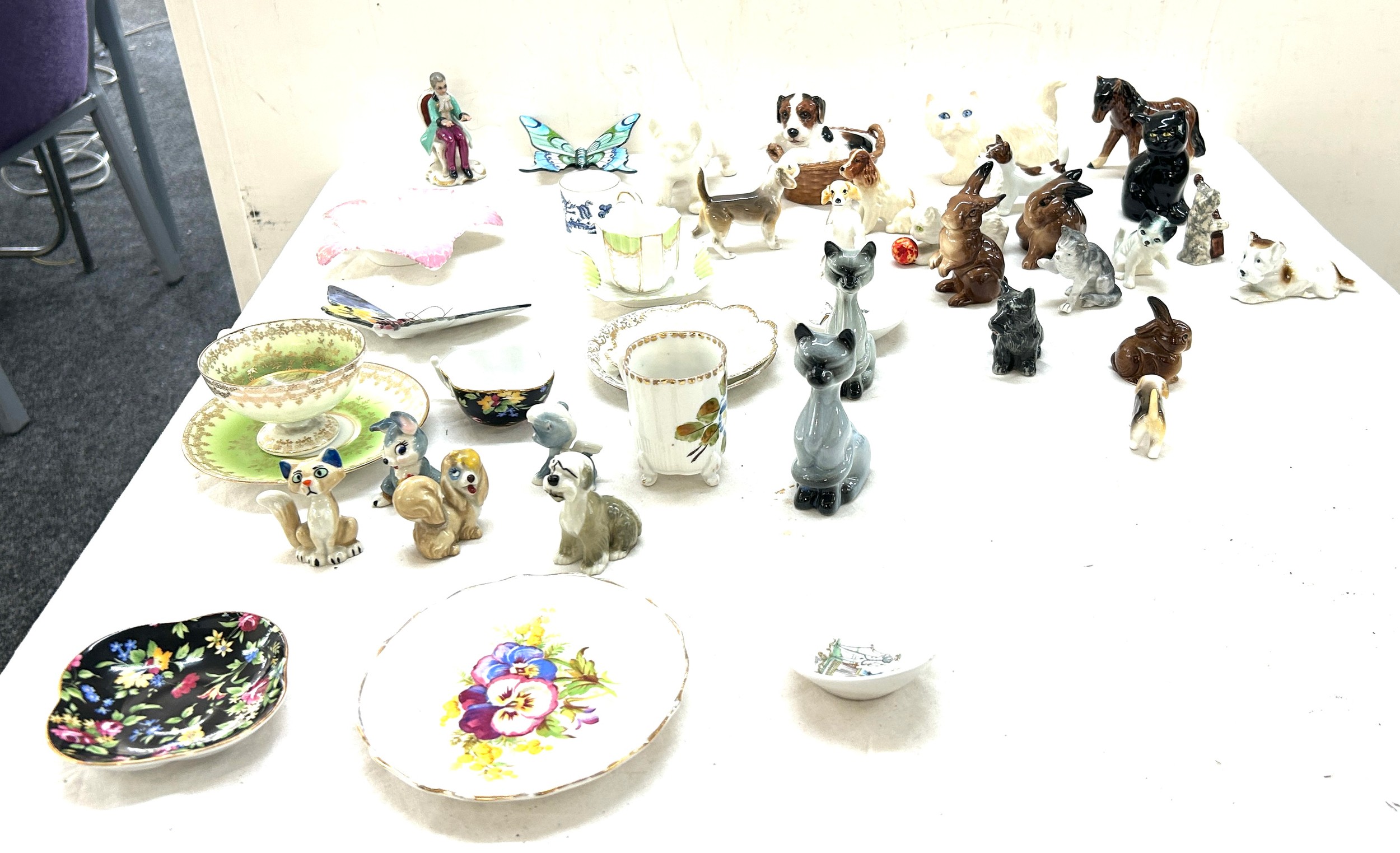 Selection of animal ornaments, miniature cups/ saucers, selection of Wade Lady and the Tramp