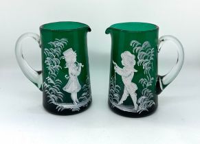 Pair of Victorian Mary Gregory green glass jugs, very good overall condition