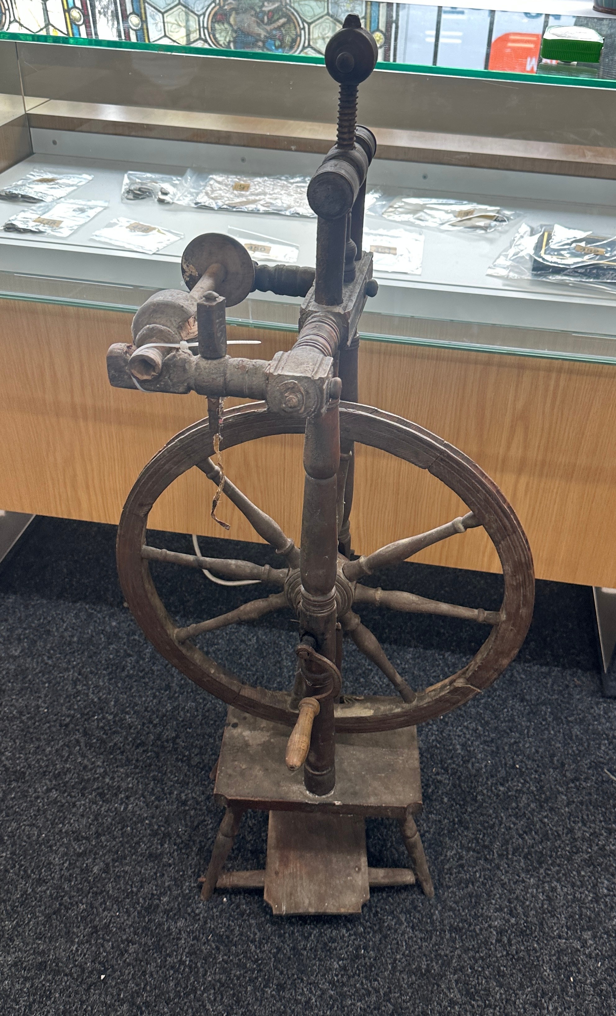 Antique spinning wheel measures approx 42 inches tall