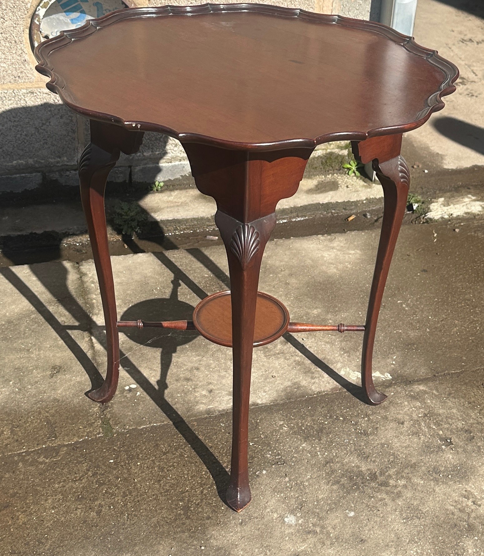 Mahogany occasional table measures approx 27 inches tall by 25 diameter