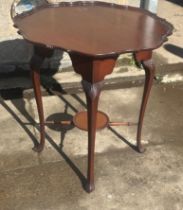 Mahogany occasional table measures approx 27 inches tall by 25 diameter