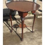 Mahogany occasional table measures approx 27 inches tall by 25 diameter