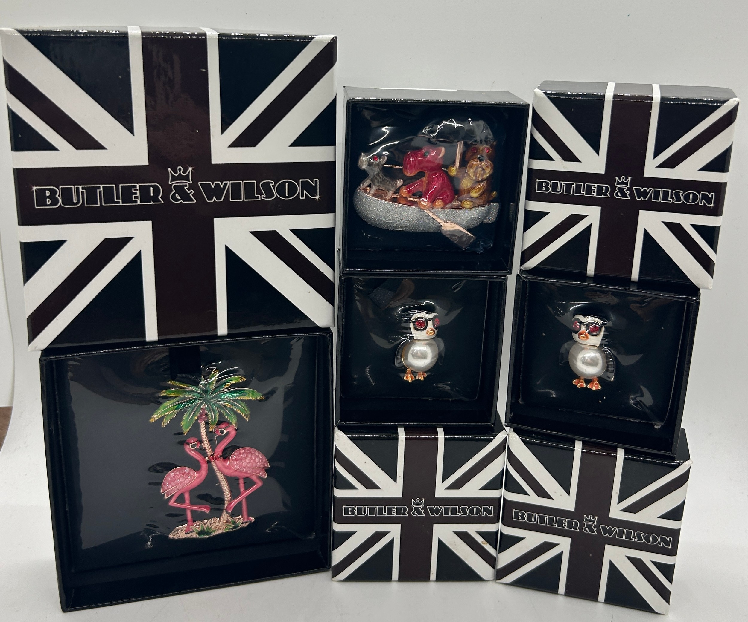 Boxed Butler and Wilson Flamingo brooch, 2 boxed Butler and Wilson Penguin brooches and a Butler and