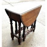 Period gate leg table with pie crust edge measures approx 26 inches tall by 26 inches wide and 13