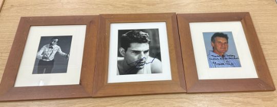 Three framed signed photos, two authentic by Andrew Sachs and Michael Palin, and one possibly the