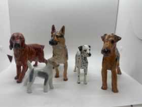 4 Royal Doulton dog figures includes Dalmatian, German Sheppard etc