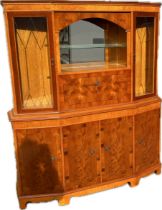 7 door yew wood drinks cabinet measures approx 68 inches tall, 58 inches wide, 15 inches deep