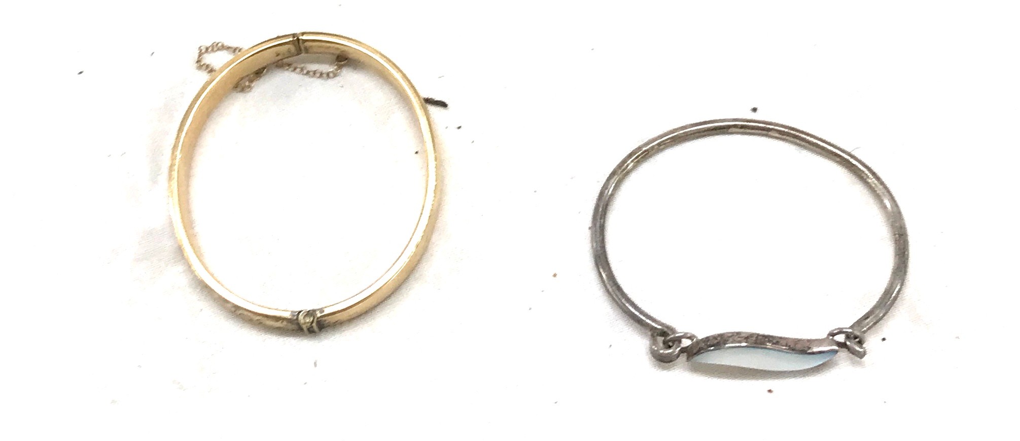 9ct gold metal core bangle and a silver stone set bangle