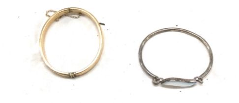 9ct gold metal core bangle and a silver stone set bangle