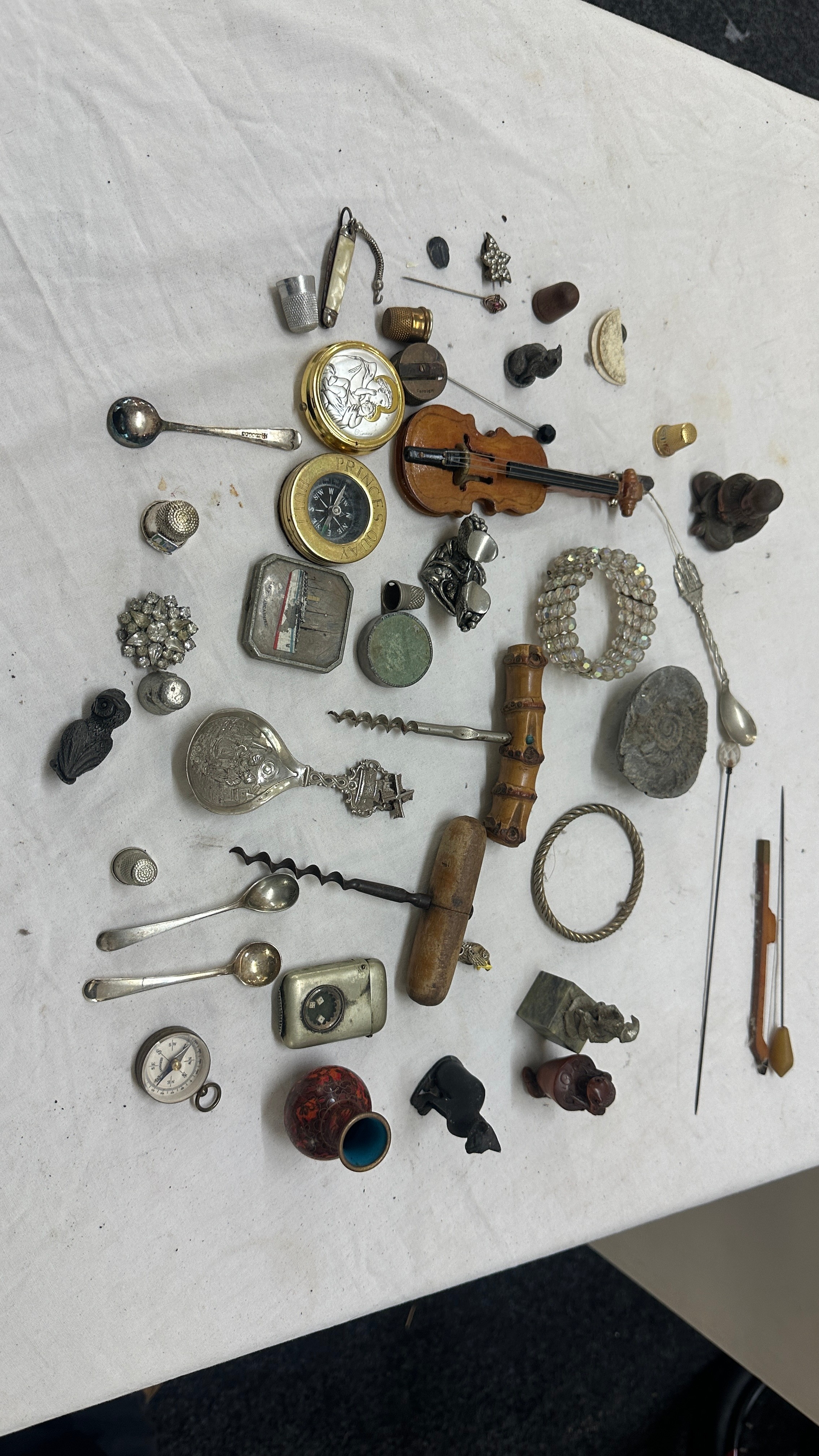 Selection of collectables includes compass, wine openers, fossils etc