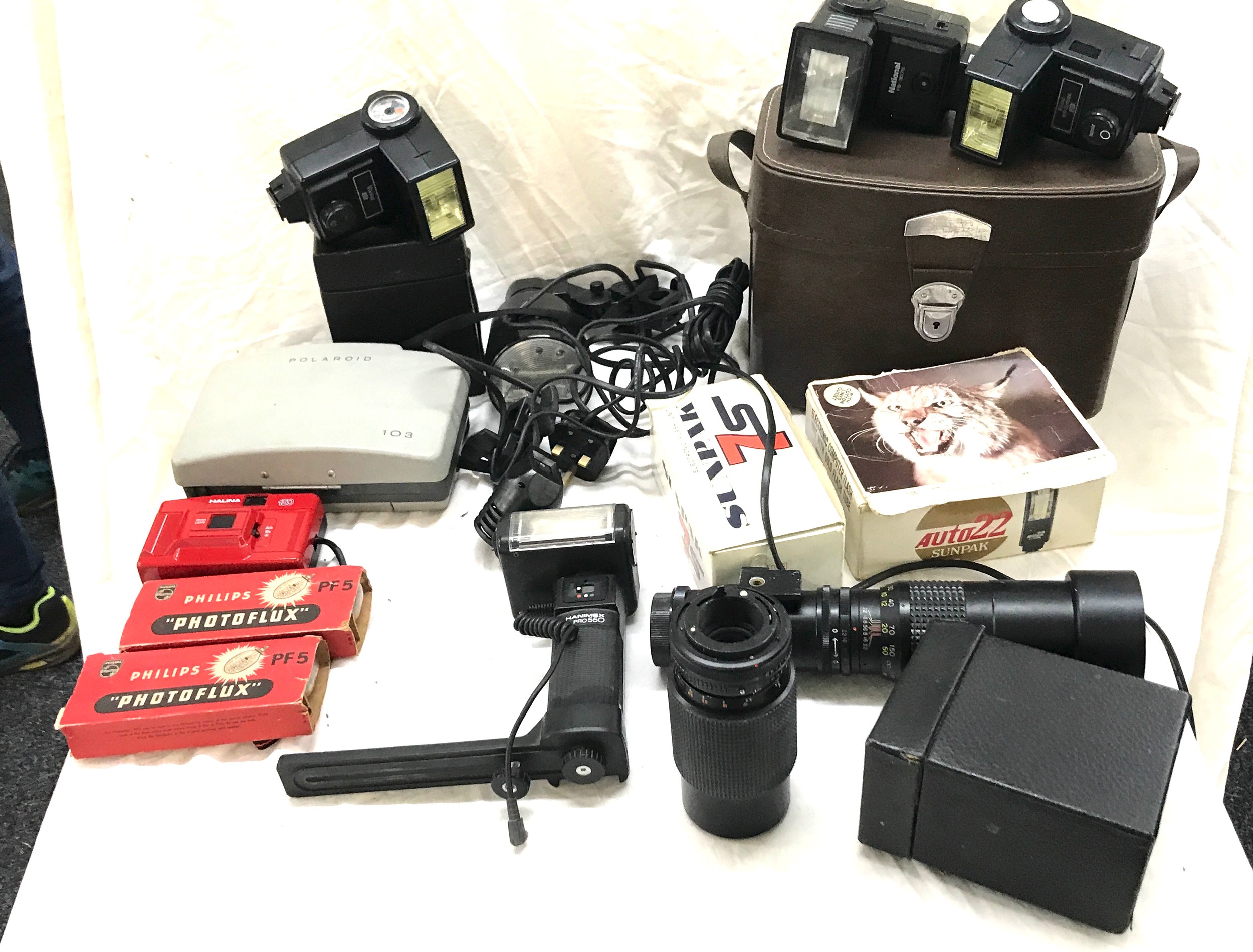 Box of cameras, lenses and other photographic equipment