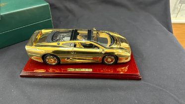Boxed Jaguar XJ220 a 22 carat gold plate limited edition model car on stand, overall length of car