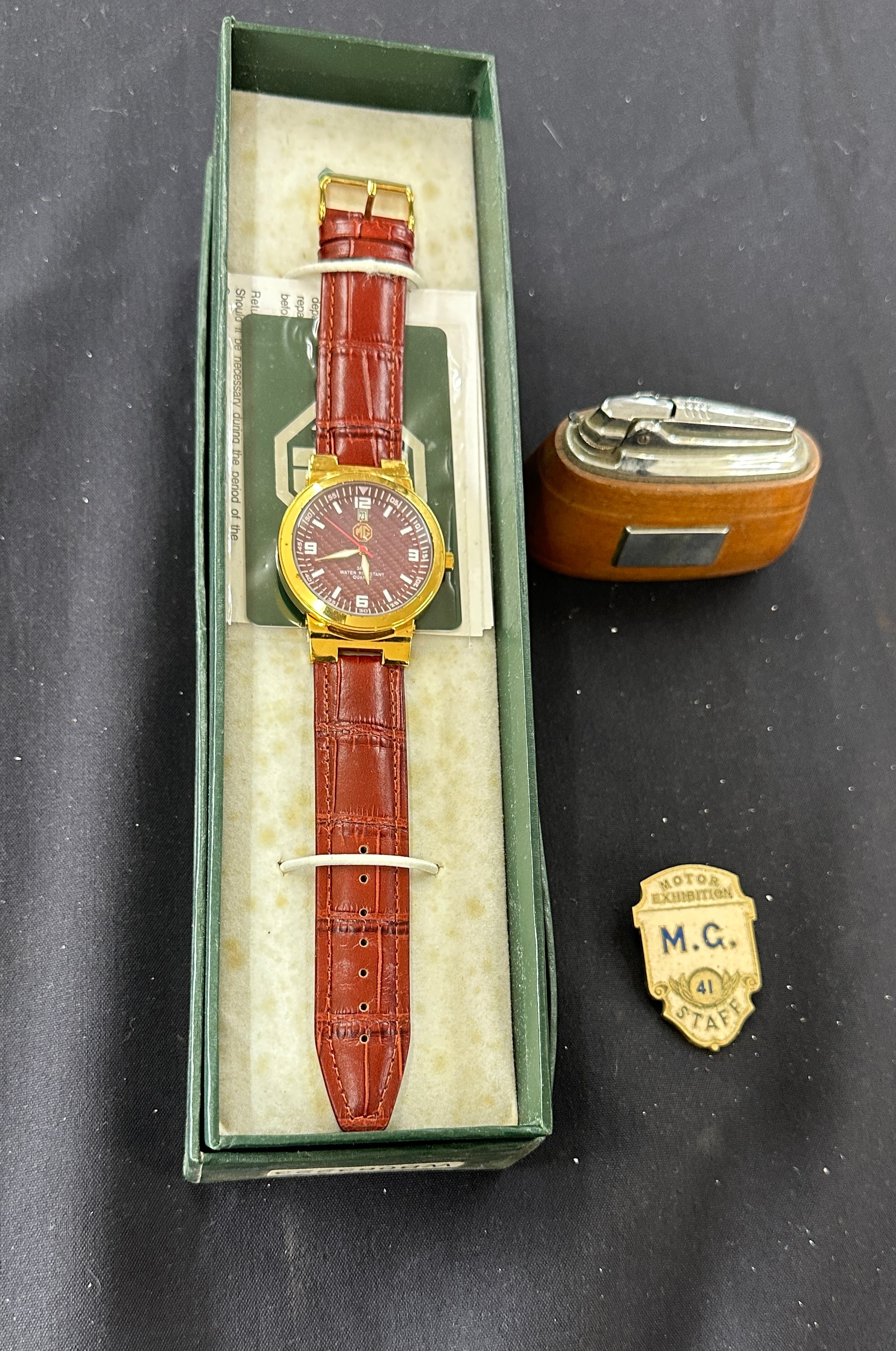 Boxed MG gents wristwatch, MG Staff exhibition badge, MG Morris table lighter (engraved)