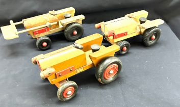 Three child vintage wooden tractors largest measures 11 inches long