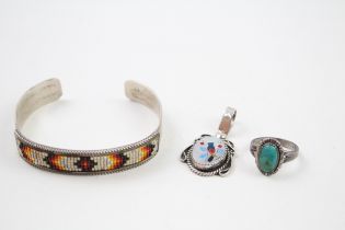 A collection of silver Native American jewellery including Charlene & Robert Little (27g)