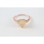 9ct rose gold trillion cut opal solitaire ring in a three claw setting (1.9g)