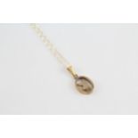 9ct gold Playboy pendant with chain (1.2g)