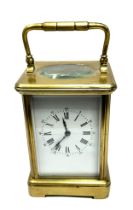 Large Vintage chiming brass carriage clock the clock is ticking measures approx height without