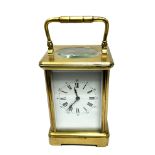 Large Vintage chiming brass carriage clock the clock is ticking measures approx height without