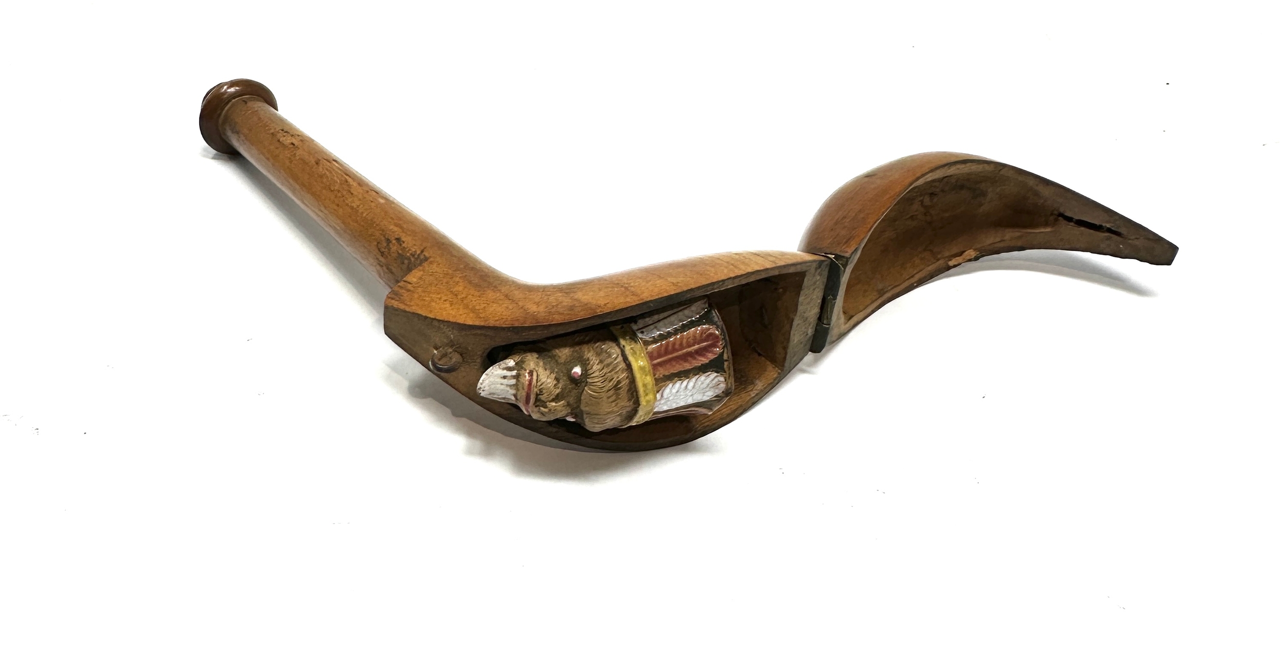 An 18thC carved fruit wood pipe case opening to reveal a clay pipe having glazed indian head - Image 4 of 4