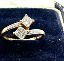 18ct gold 2 square cut diamond with diamond shoulders est 0.60 pt diamonds weight of ring 2.1g