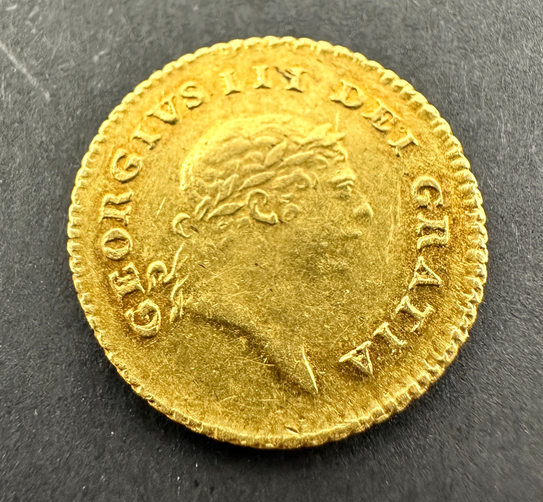 A rare, collectable gold Third-Guinea of King George III, dated 1810. The obverse features the fifth
