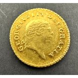 A rare, collectable gold Third-Guinea of King George III, dated 1810. The obverse features the fifth