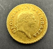 A rare, collectable gold Third-Guinea of King George III, dated 1810. The obverse features the fifth