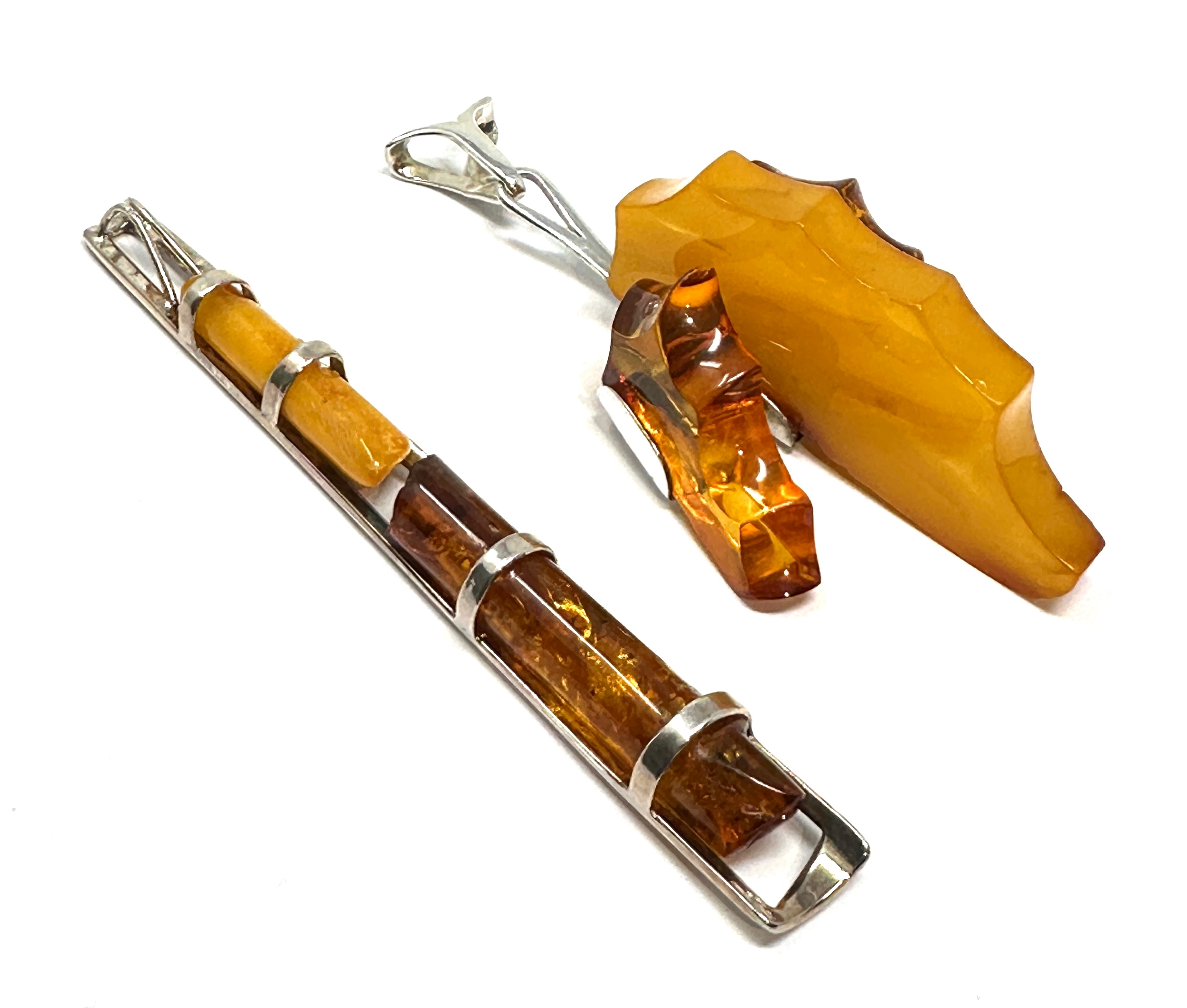 2 silver & amber pendants