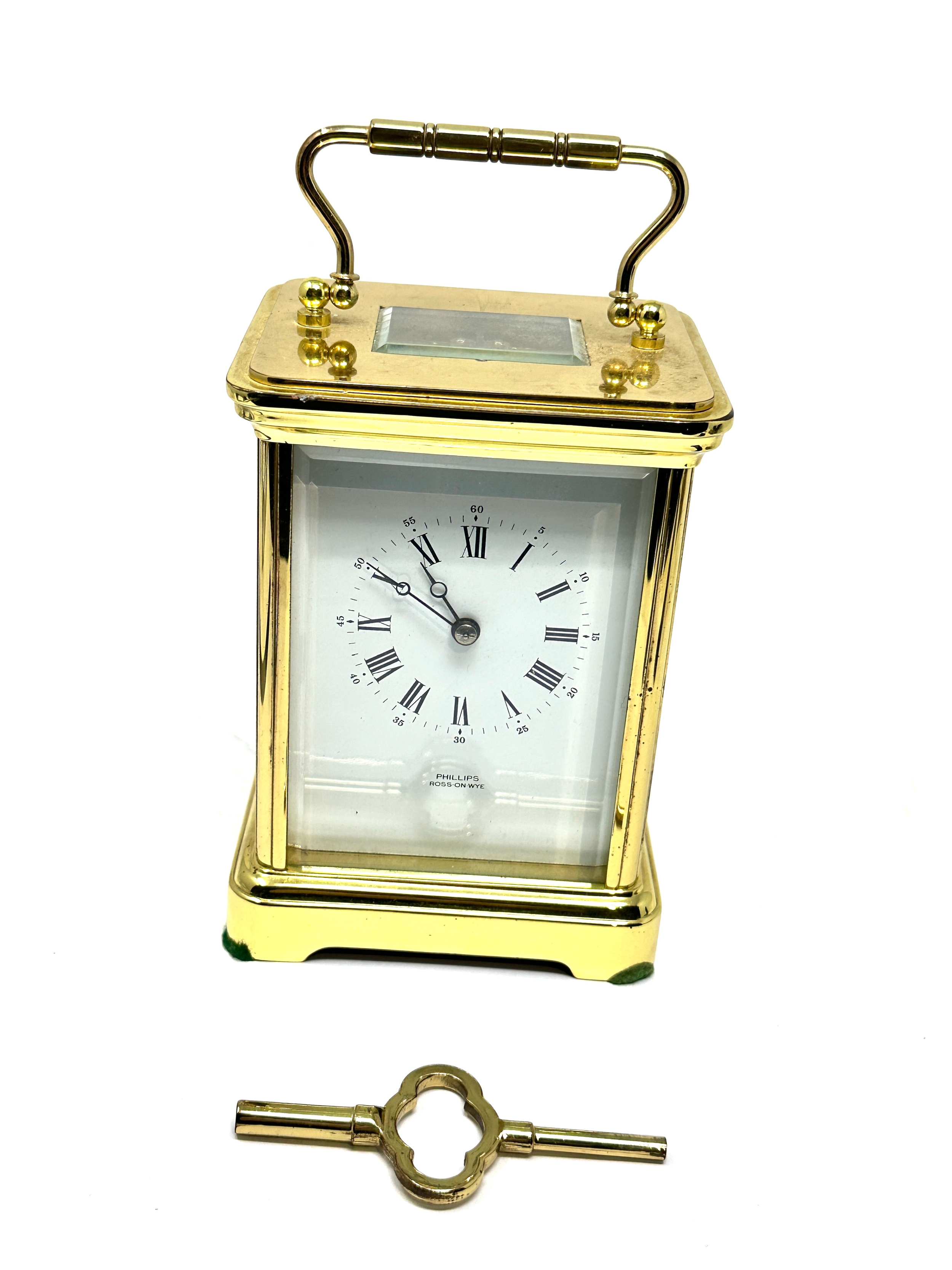 Large striking brass carriage clock measures approx 14cm high comes with key the clock is ticking