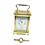 Large striking brass carriage clock measures approx 14cm high comes with key the clock is ticking