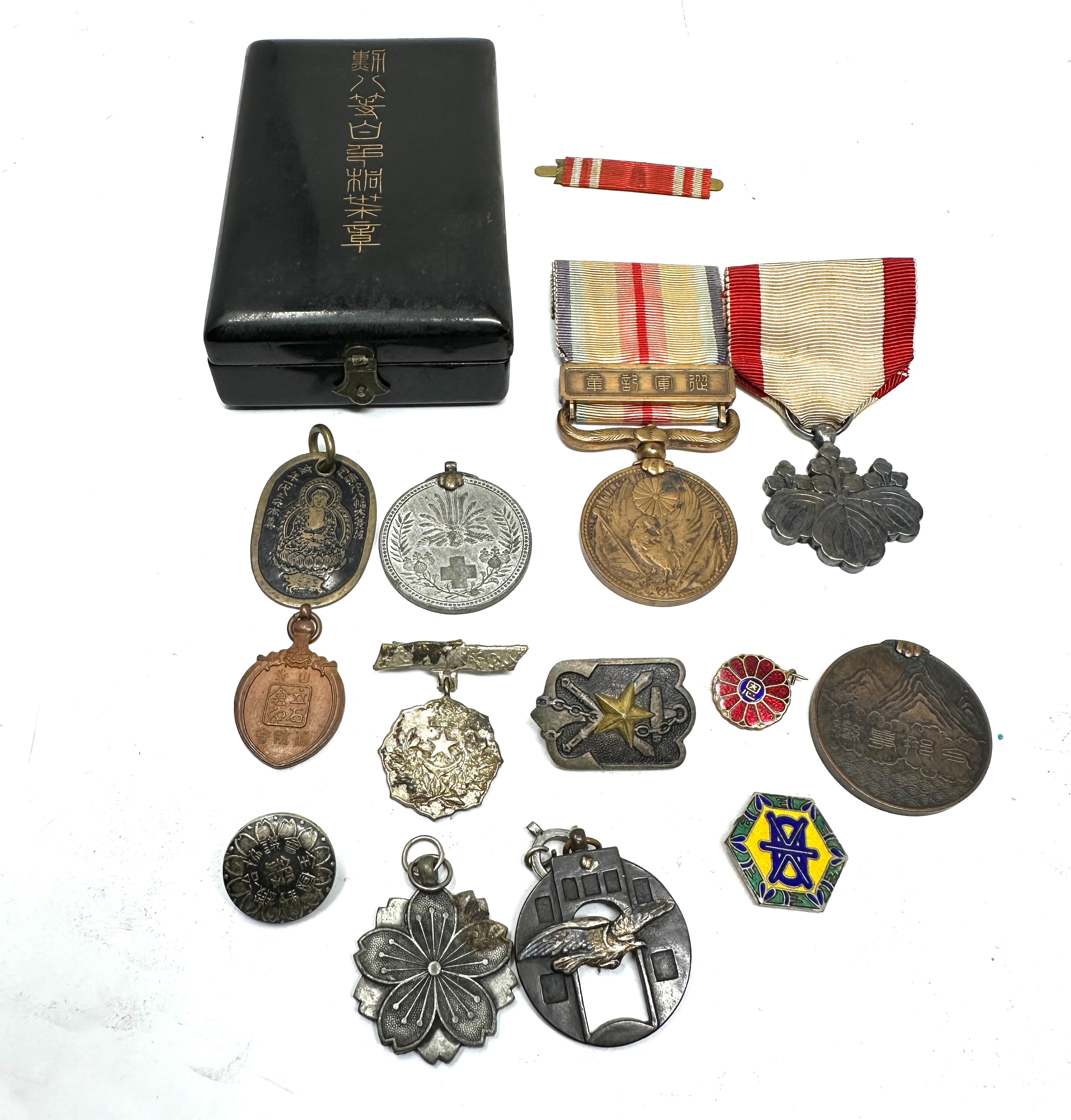 selection of ww2 japanese medals pins etc with original medal box