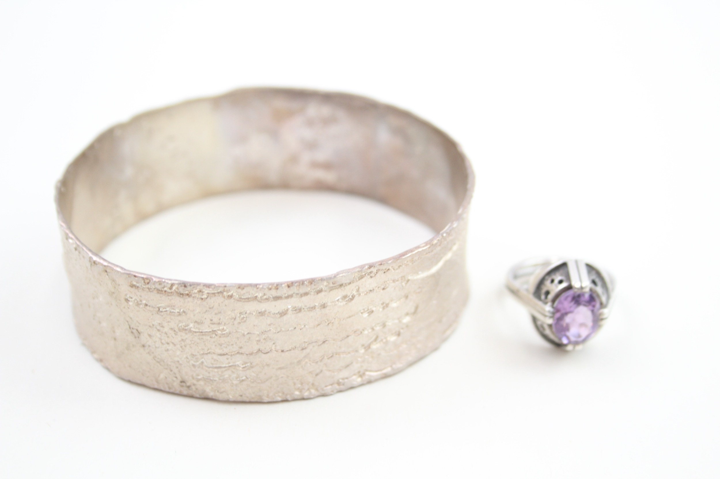 A silver modernist textured bangle and a mid century ring (62g)