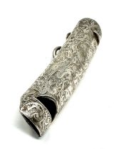 Unusual antique silver vesta box of oval form with hand-engraved scroll decoration and hinged lid.