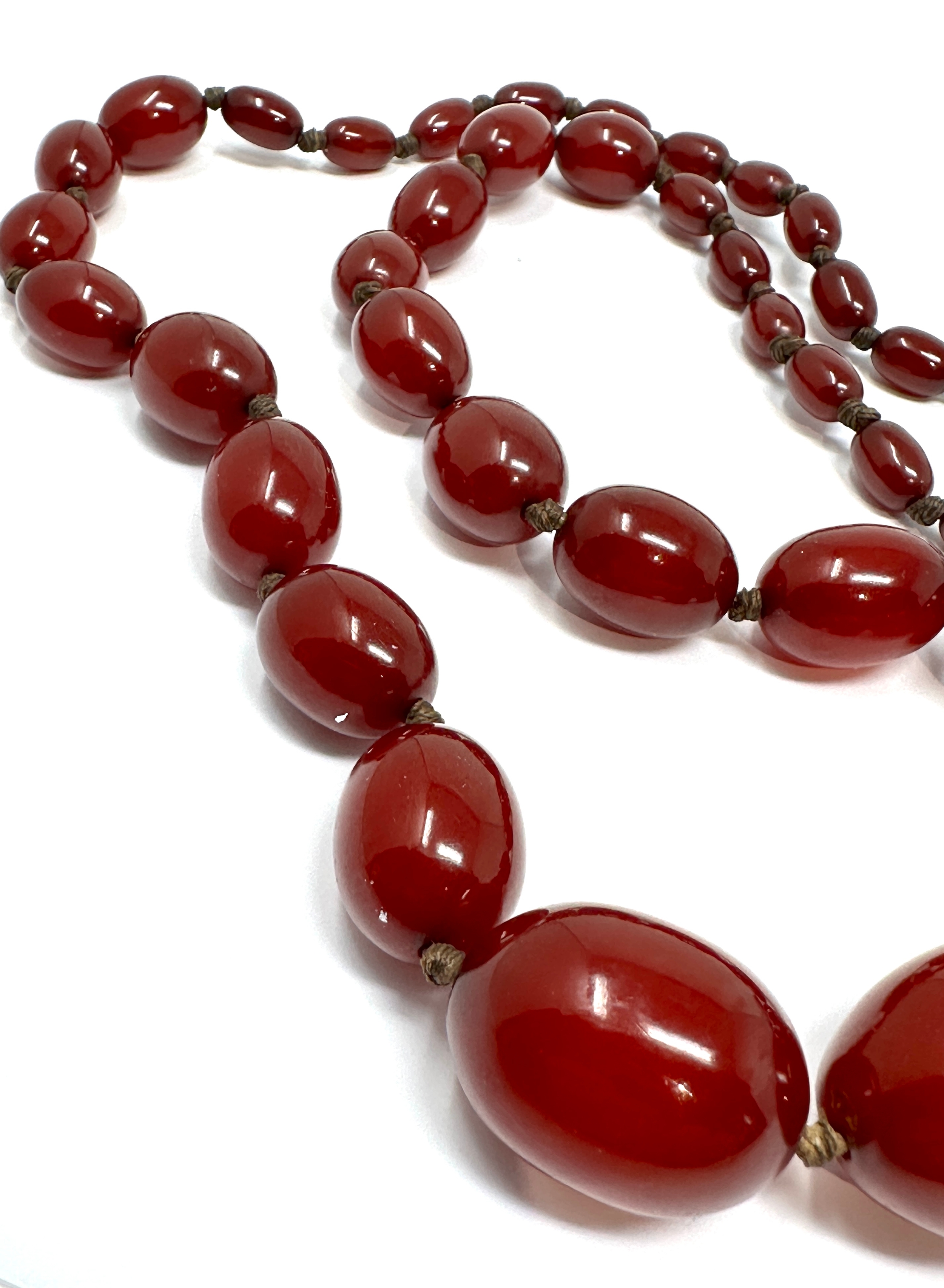 Antique / vintage cherry bakelite graduated bead necklace largest bead measures approx 30mm by - Image 3 of 4