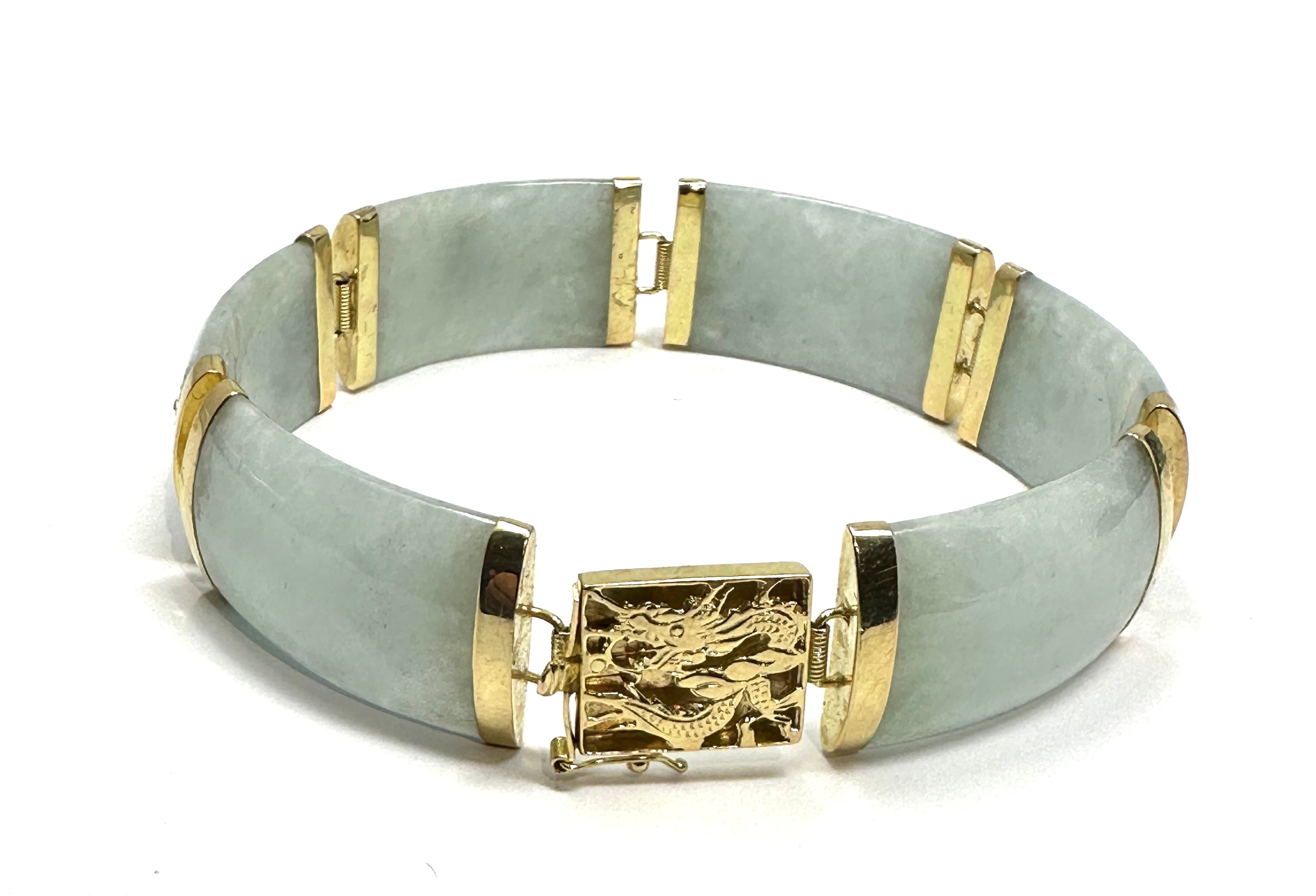 Chinese 14ct gold & jade bracelet jade panels with 14ct gold mounts clasp has dragen details