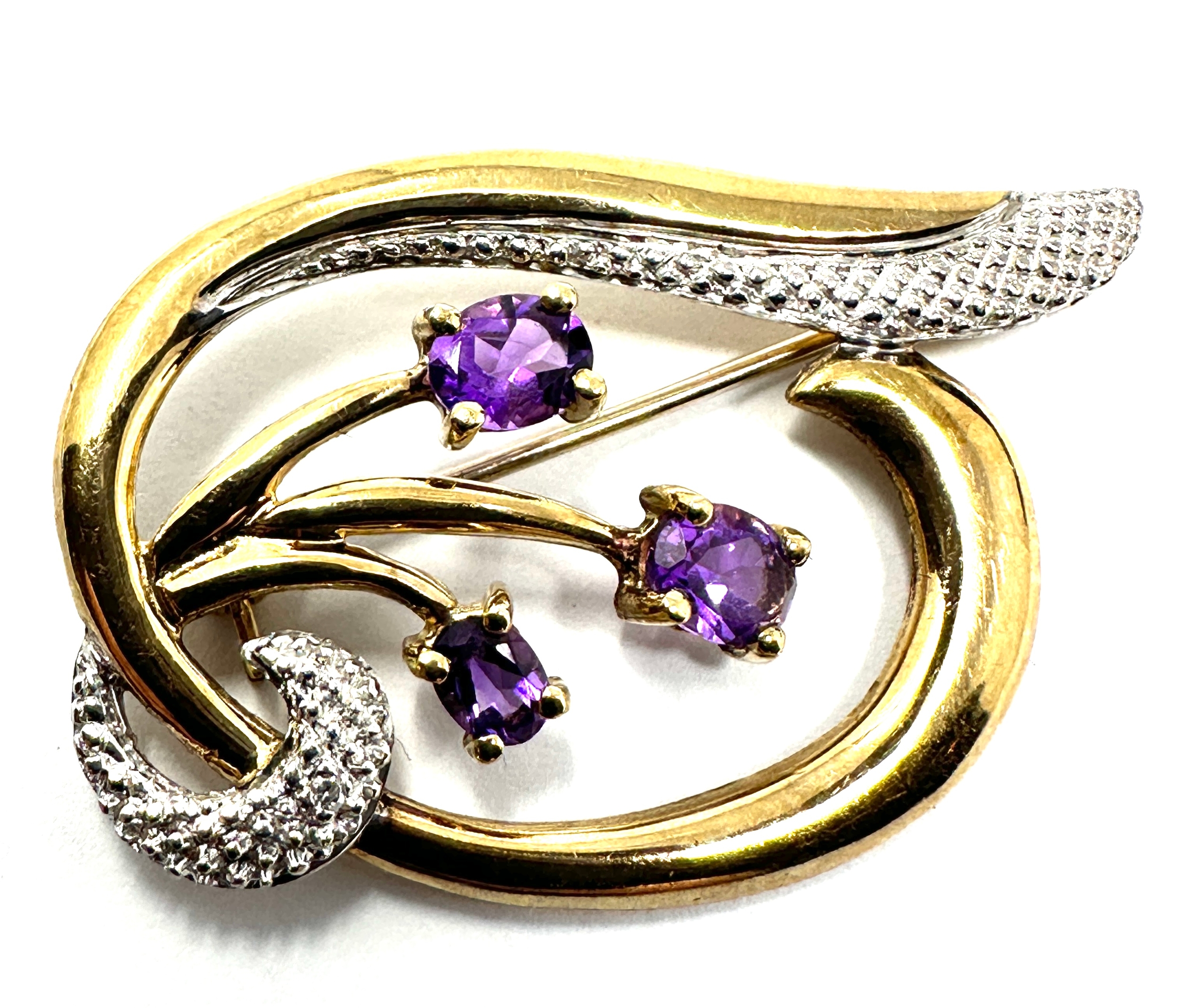 9ct gold amethyst & diamond brooch measures approx 4cm by 2.2cm weight 3.7g