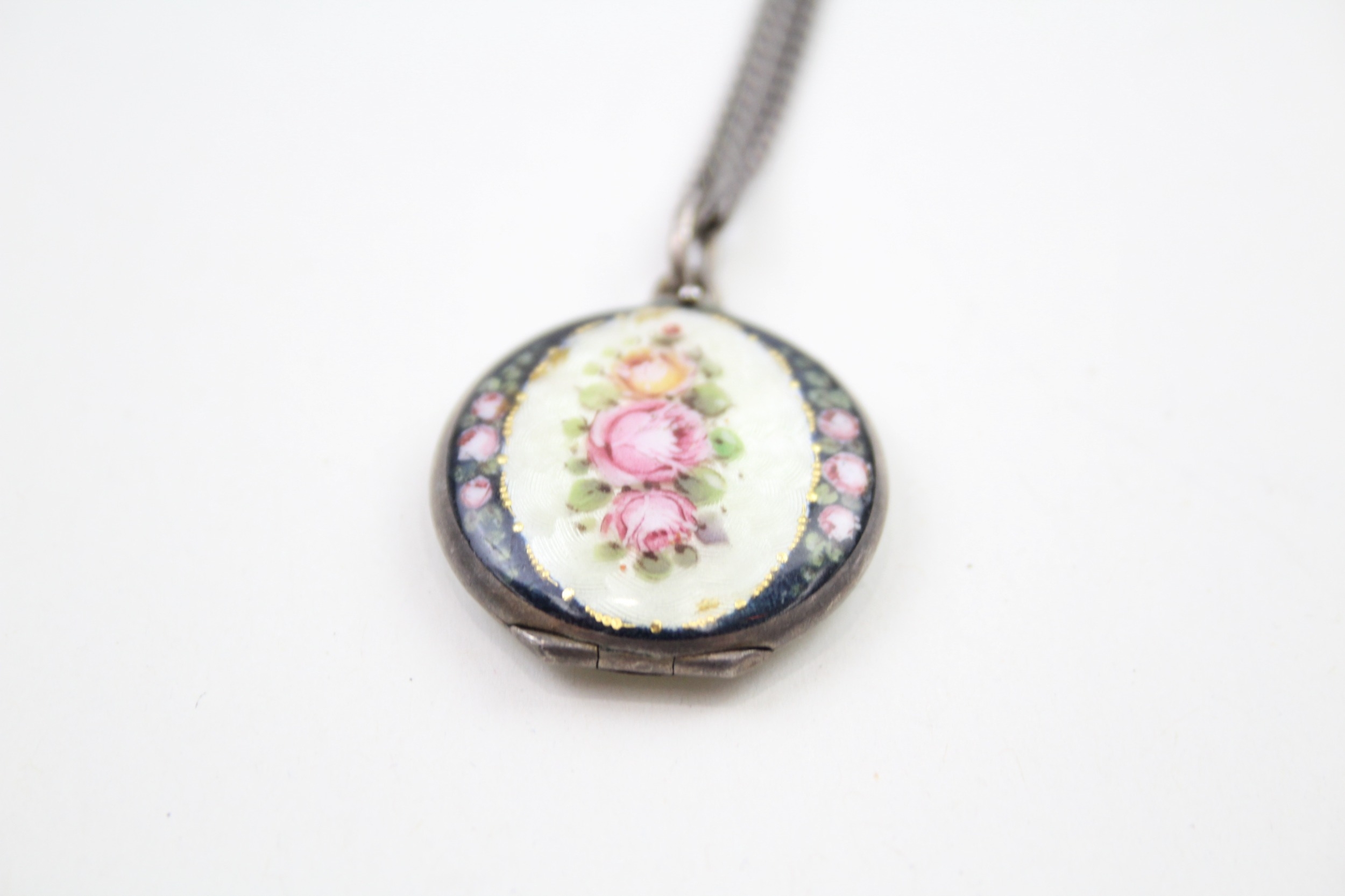 A silver floral guilloche enamel locket with chain (17g)