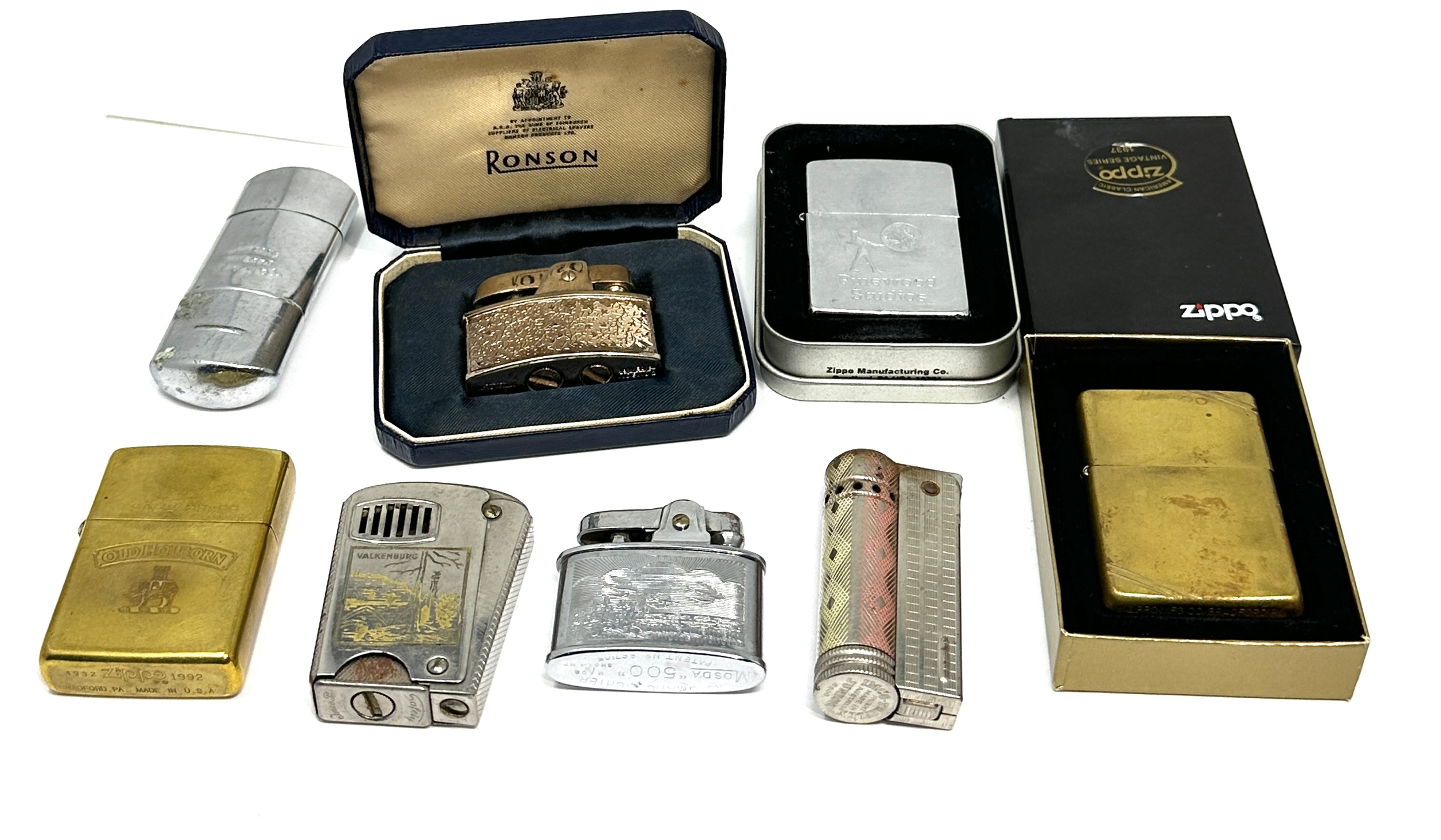 Collection of vintage cigarette lighters includes zippo etc