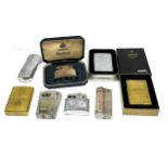 Collection of vintage cigarette lighters includes zippo etc