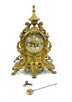 Brass style mantel clock 17 inches tall 12 inches wide with key and pendulum